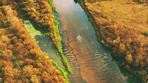 Aerial View Of Old Boat Floating In River Autumn Landscape