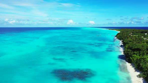 Aerial panorama of marine island beach adventure by transparent ocean with clean sand background of 