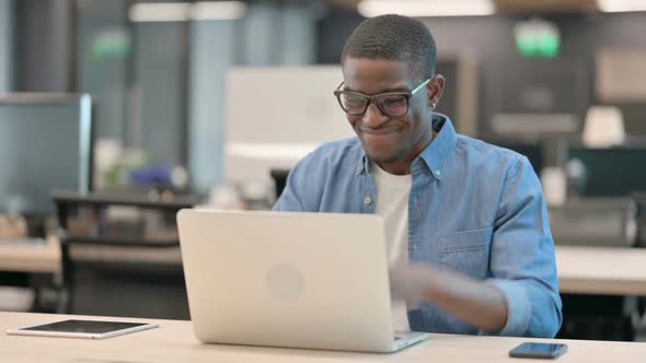 Young African American Man Feeling Angry at Work