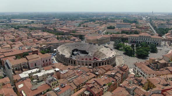 Flying over Arena - Roman amphitheatre in Verona city, Italy, Europe