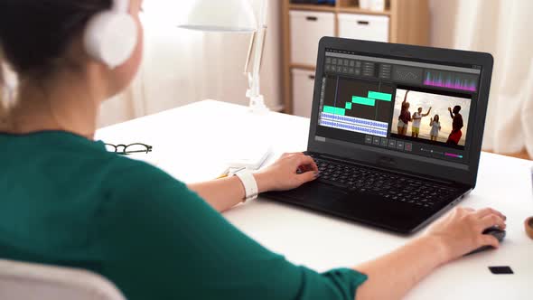 Woman with Video Editor Program on Laptop at Home