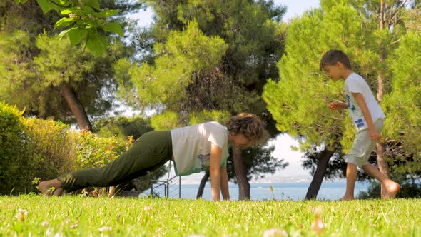 Sportive Mother Practices Yoga Outdoor