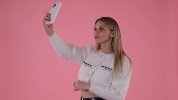 Sexy Blonde Takes a Selfie on the Phone