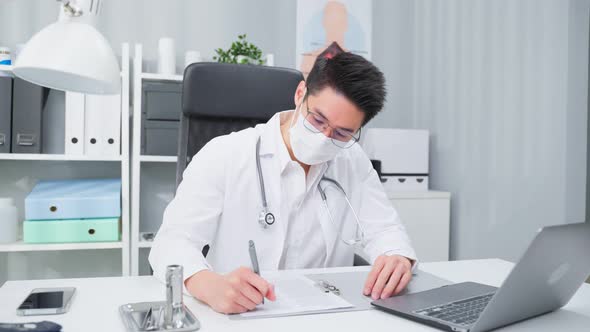 Asian professional medical doctor male working from office hospital.