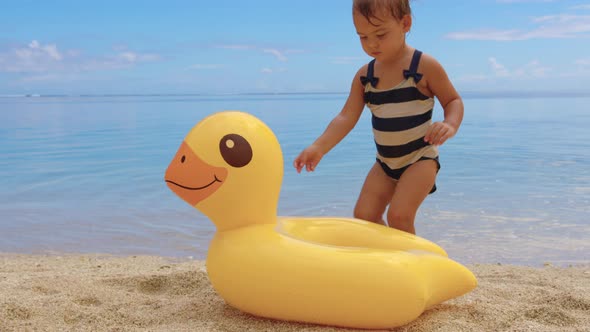 Adorable Little Girl on Warm and Sunny Summer Day on the Coastline Indian Ocean