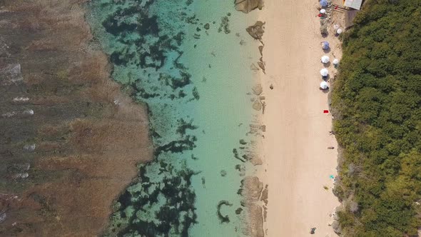 Beautiful Melasti Beach From Above. Amazing Popular White Sand Beach with Clear Water. Beautiful