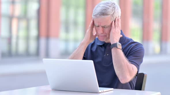 Outdoor Middle Aged Businessman Having Headache on Laptop