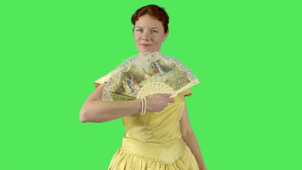 Female close up holding fan