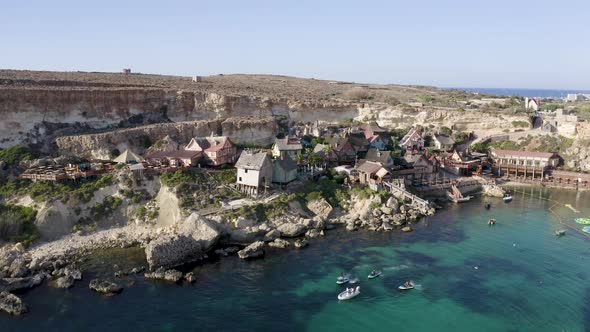 Boats sailing from the Popeye village theme park,Malta,aerial view.