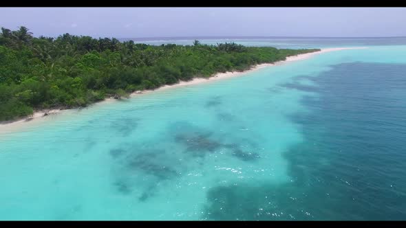 Aerial above travel of idyllic sea view beach trip by blue sea with white sandy background of a dayo