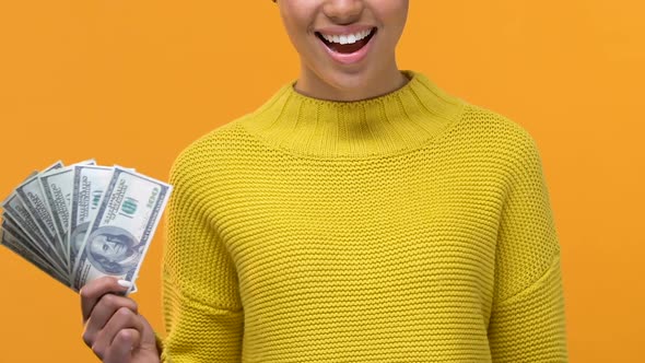 African Female Holding Dollar Bills and Showing Ok Sign, Credit Approval, Bonus