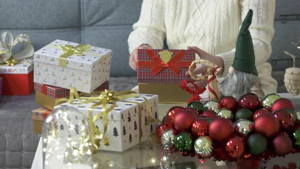 Woman Wrapping Christmas Gifts