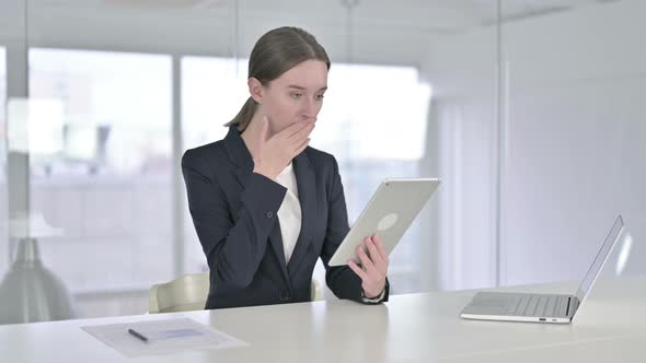 Disappointed Young Businesswoman Reacting To Loss on Tablet