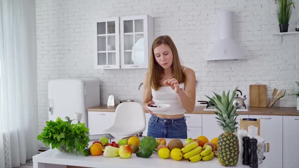 Young woman in the modern kitchen