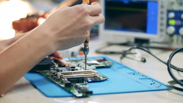 Technician Taking Off Heat Sink Screwdriver From Motherboard