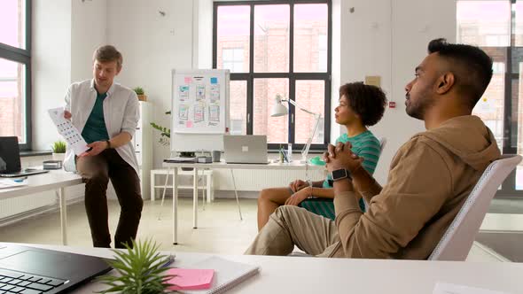 Designer Showing Ui Design Template To Colleagues 96