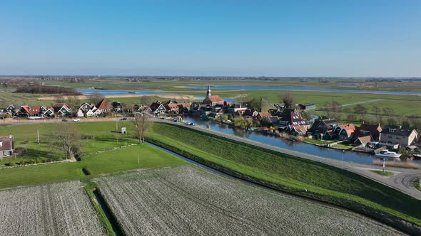 Small Historic Typical Dutch Polder Farm Village in Green Countryside Sunny Spring Landscape with