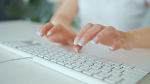 Female Hands Typing on a Computer Keyboard