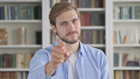 Portrait of Man Pointing at the Camera