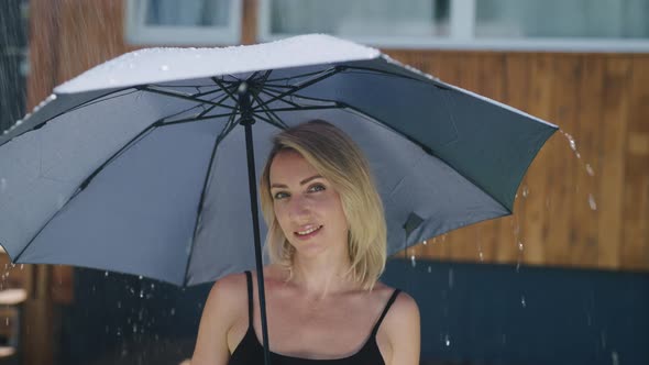 Attractive Blonde in the Summer Rain