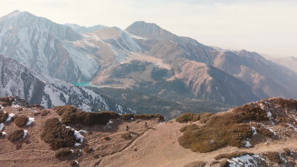 Aerial Shot of Small Hikers in the Beautiful Mountains