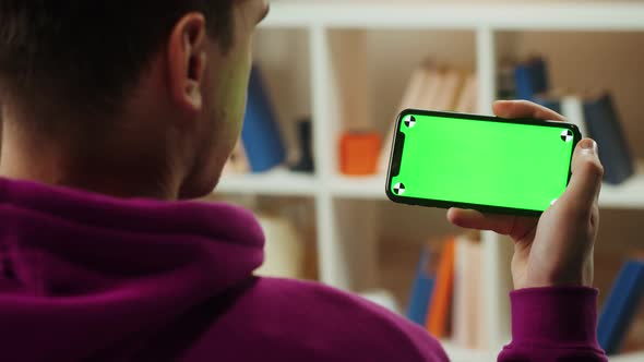 Man Using Smartphone with Chroma Key Closeup