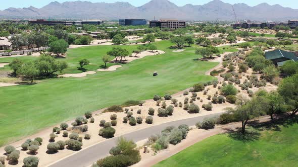 Aerial view of a golf course and luxury destination resort.