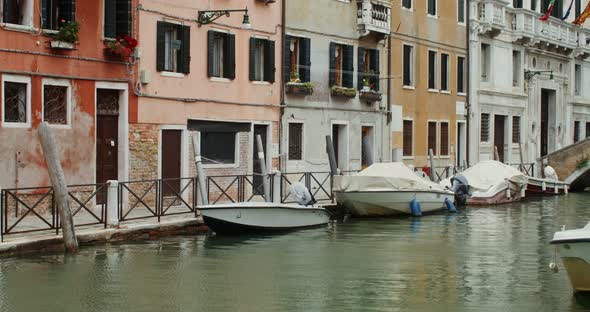 Panoramic View of Narrow Street with Colorful Houses on Both Sides of the Canal