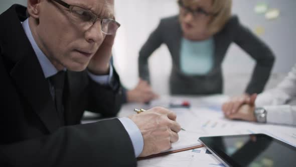 Unhappy Manager Avoiding Eye Contact With Annoyed Woman Boss, Job Stress