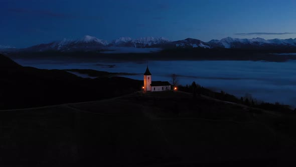 Church of St. Primoz and Felicijan in the Morning. Jamnik, Slovenia. Aerial View