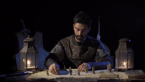 The commander making a plan on the map. War preparation in historical times. alt