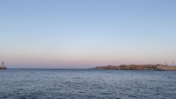 Beautiful Panning Timelapse over Valletta Break Water durin Dusk in Malta - Blue Hour