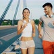 Attractive Man and Beautiful Woman Jogging Together - VideoHive Item for Sale