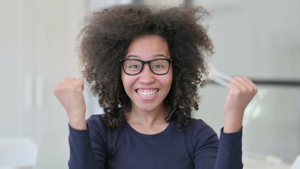 Portrait of African Woman Celebrating Success