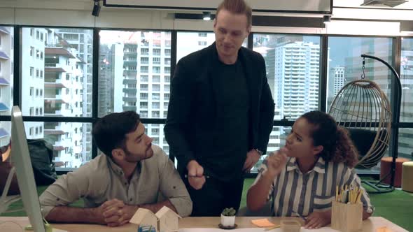 Creative Business People Group Having Conversation at Office Desk in Workplace