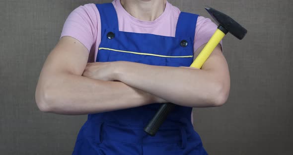 Female Worker with a Mallet