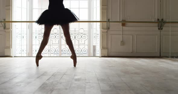 Slow motion shot of ballerina dancing in studio