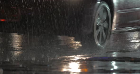 Cars Driving Under the Rain at Night