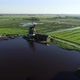Aerial view of historical windmills in Zaanse Schans, Amsterdam, Netherlands. Famous place to visit - VideoHive Item for Sale