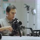 An Asian man is installing a camera rig  - VideoHive Item for Sale