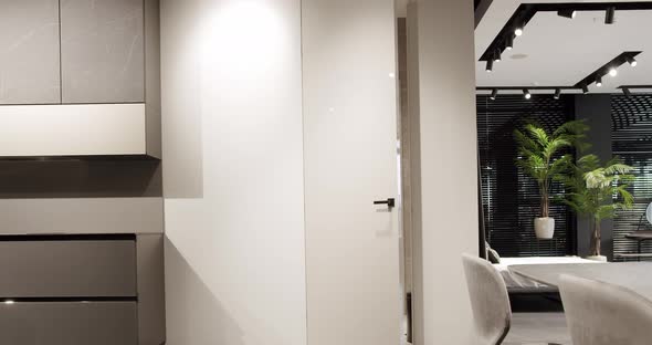 The minimalist white door closed in a modern home. Modern Showroom.