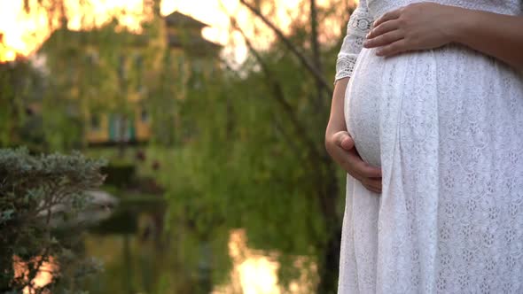 Pregnant Woman Feeling Happy at Garden Home