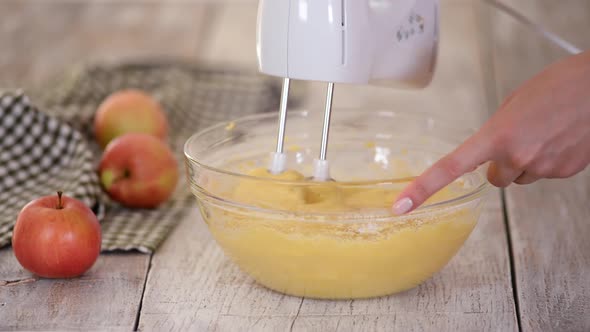 Whipping Cake Batter with a Mixer.