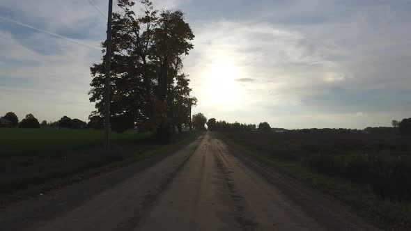 Dust road at sunset