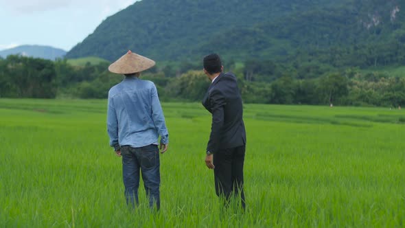 Farmer and BusinessmanTalking