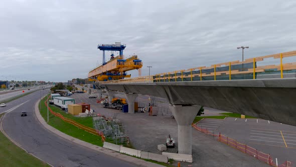 4K camera drone view of the construction site of the REM (Metropolitan Express Network) in Montreal.