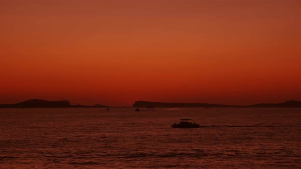 Ships going past after the Sunset in the Sea 