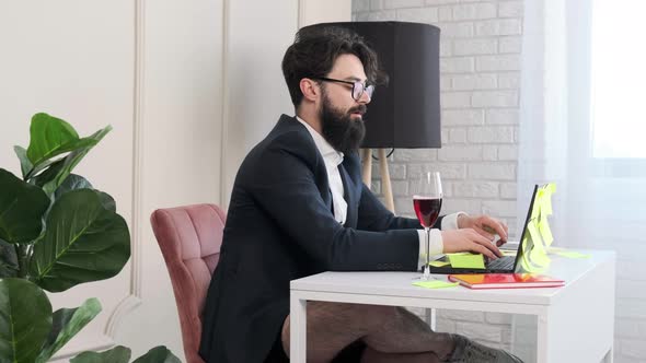 Bearded Man with No Pants Close the Computer and Enjoy a Glass of Wine