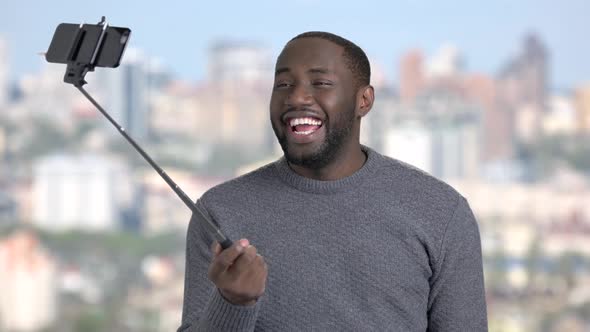 Funny African-american Guy Using Selfie Stick