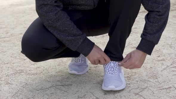 Runner just laces his shoes in slow motion and starts running